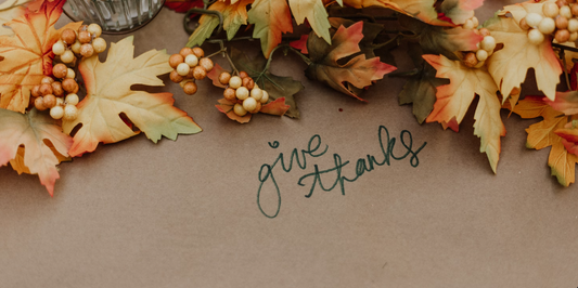 Give thanks written on Thanksgiving dinner table